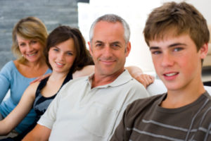 Family sitting on a couch