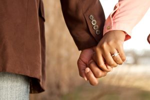 Couple holding hands